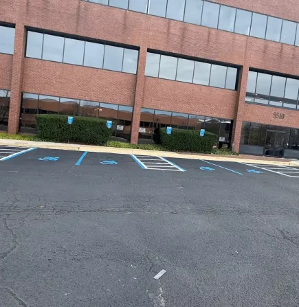 Freshly striped accessible parking spaces in lot